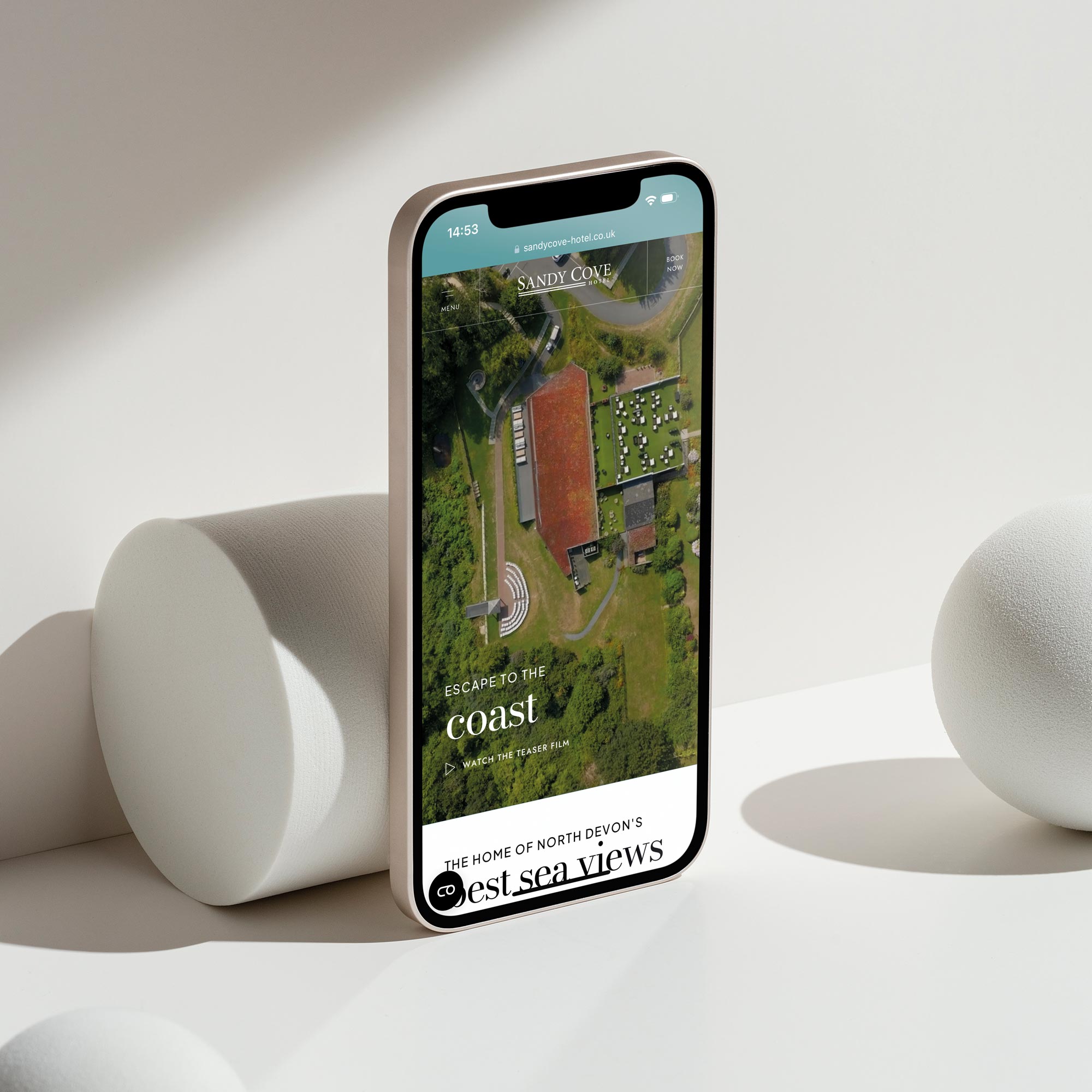 The Sandy Cove Hotel website homepage on a smartphone designed by Inventive