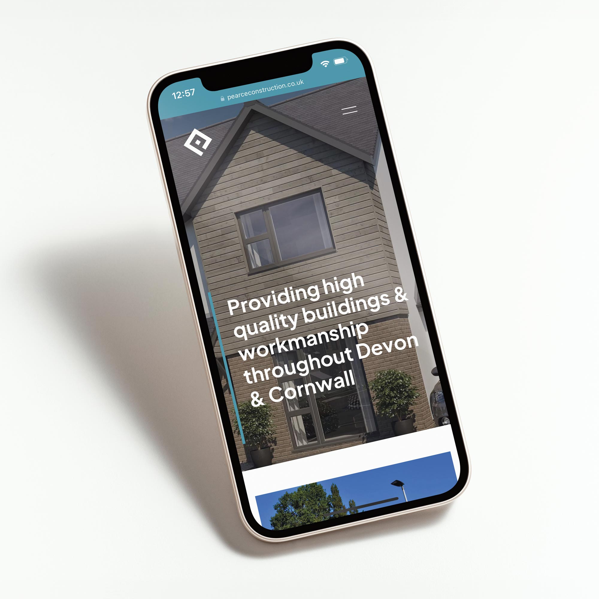 Pearce homes new website displayed on a mobile phone.